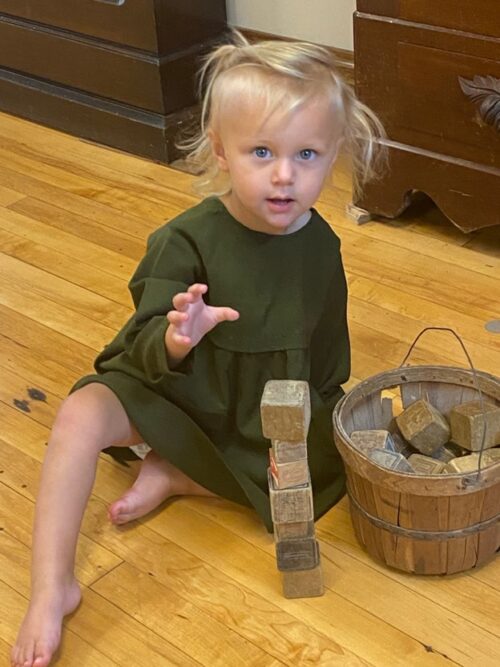 Hazel in dress made by great-great-great grandmother