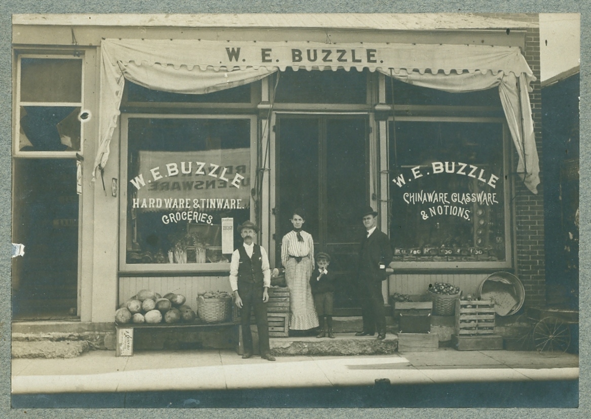 Buzzle grocery in Bourbon, William Buzzle, Mrs. Reubelt, child and "traveling man", salesman.